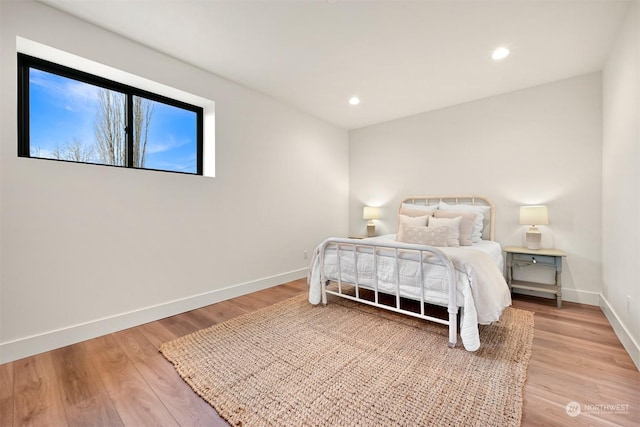 bedroom with wood-type flooring