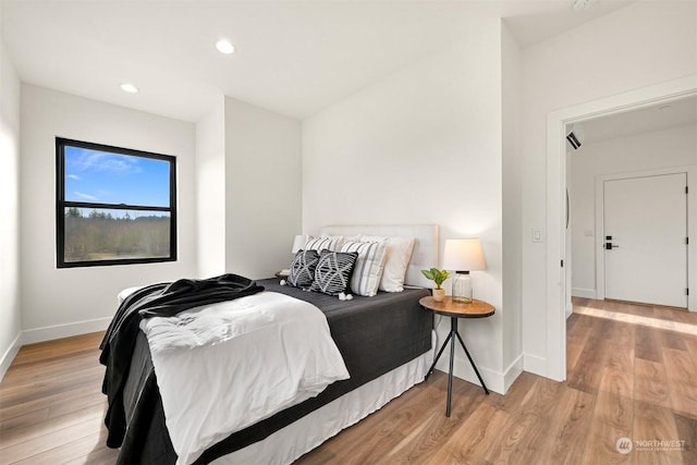 bedroom with light wood-type flooring