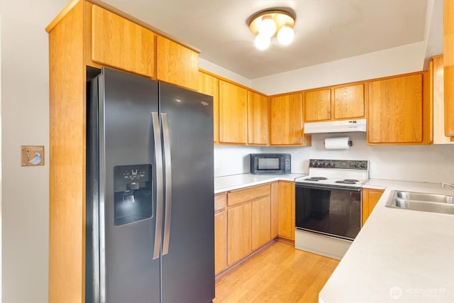 kitchen featuring light wood-type flooring, sink, white electric range, and stainless steel fridge with ice dispenser