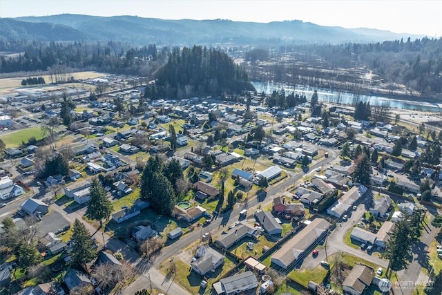 bird's eye view with a water and mountain view