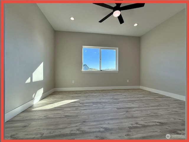 empty room featuring light hardwood / wood-style flooring and ceiling fan