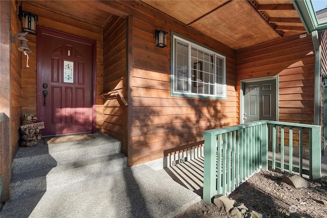 property entrance with covered porch