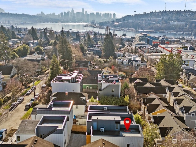 bird's eye view featuring a water view and a view of city