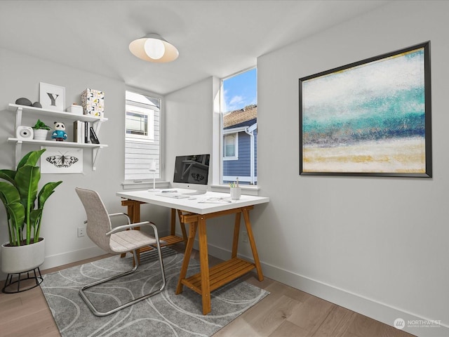 office with baseboards and light wood-type flooring