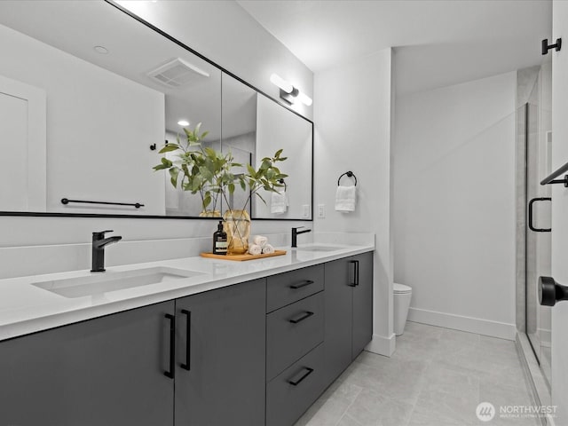 bathroom with a sink, visible vents, double vanity, and a shower stall