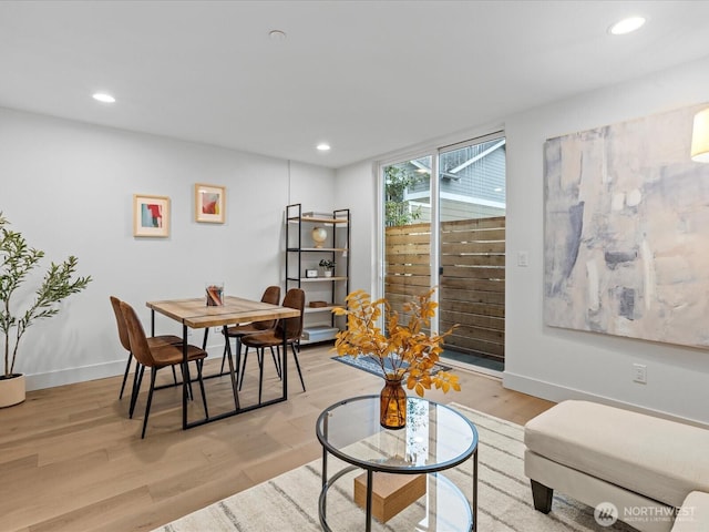 dining area featuring light wood-style flooring, recessed lighting, and baseboards