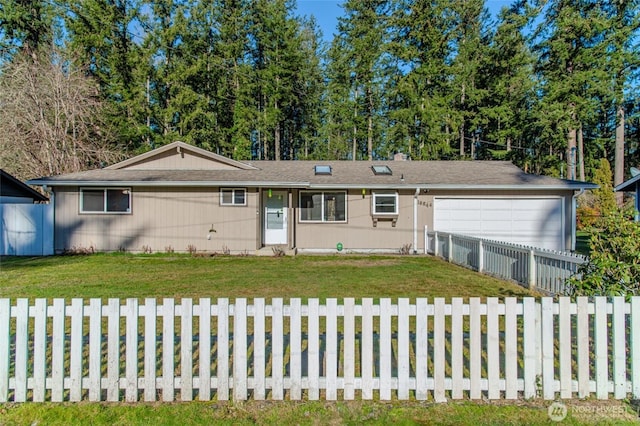 single story home featuring a front lawn, driveway, a garage, and a fenced front yard