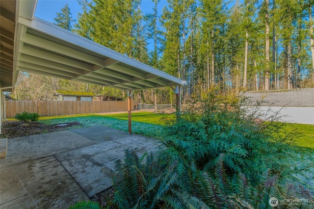 view of patio featuring fence