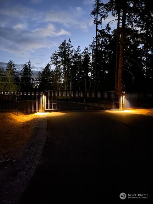 view of gate at dusk