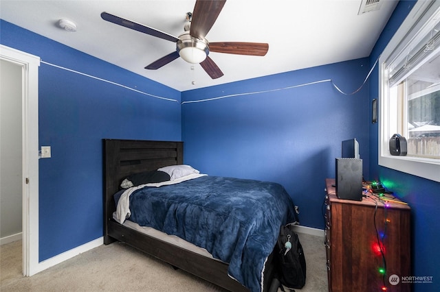 carpeted bedroom featuring ceiling fan