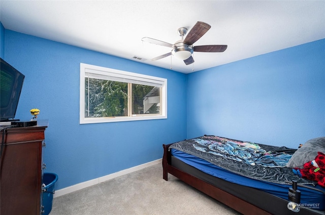 carpeted bedroom with ceiling fan