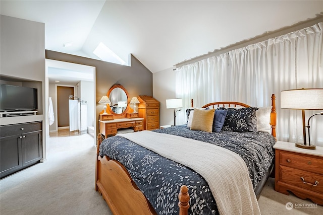 carpeted bedroom featuring lofted ceiling