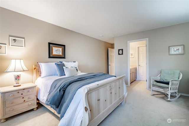 carpeted bedroom with connected bathroom