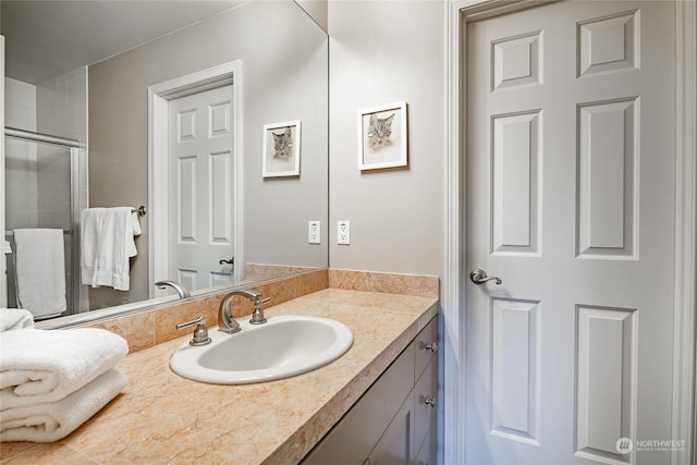 bathroom featuring vanity and walk in shower