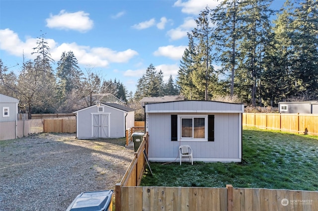 view of outbuilding with a yard