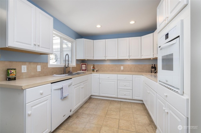2804 M Ave, Anacortes, WA 98221 - kitchen featuring tasteful backsplash, white appliances, sink, and white cabinets