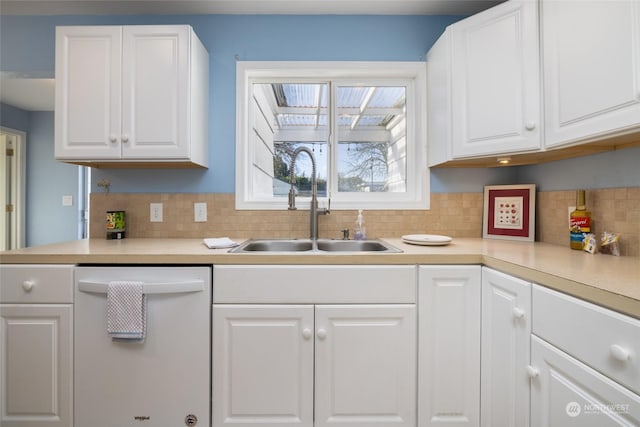 2804 M Ave, Anacortes, WA 98221 - kitchen featuring white dishwasher, sink, tasteful backsplash, and white cabinets