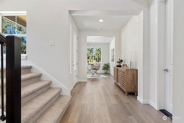 foyer entrance with light hardwood / wood-style flooring