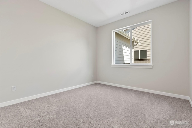 unfurnished room featuring carpet flooring