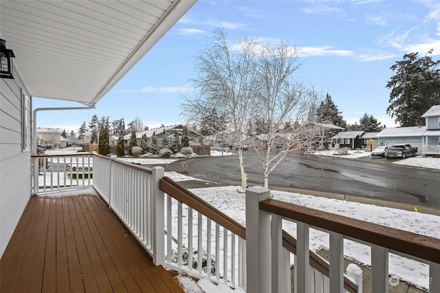 snow covered deck with covered porch