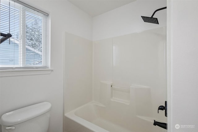 bathroom with shower / tub combination and toilet