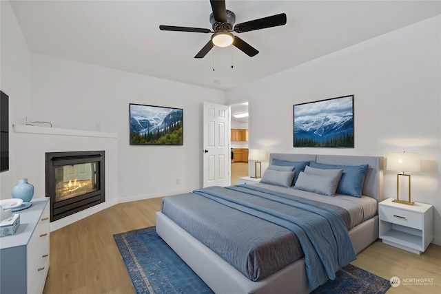 bedroom featuring light hardwood / wood-style floors and ceiling fan