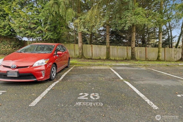 uncovered parking lot with fence