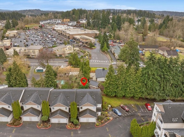 birds eye view of property with a forest view