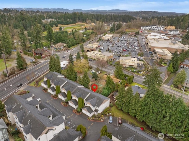 birds eye view of property with a wooded view