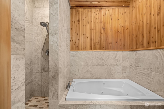 bathroom with separate shower and tub