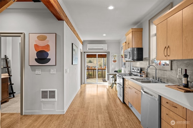 kitchen featuring sink, appliances with stainless steel finishes, a wall mounted AC, ornamental molding, and light brown cabinets