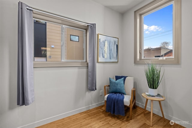 sitting room with hardwood / wood-style floors