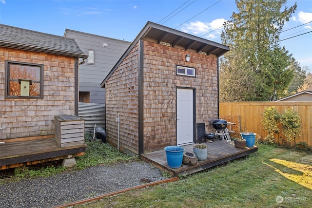 view of outbuilding with a lawn