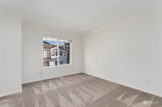 carpeted empty room with crown molding