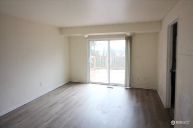 empty room featuring hardwood / wood-style floors