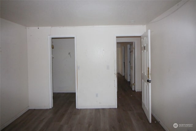 spare room with dark hardwood / wood-style floors