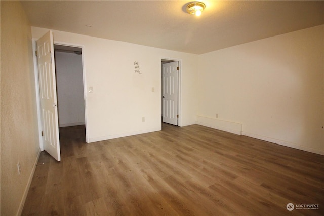 unfurnished bedroom featuring hardwood / wood-style floors