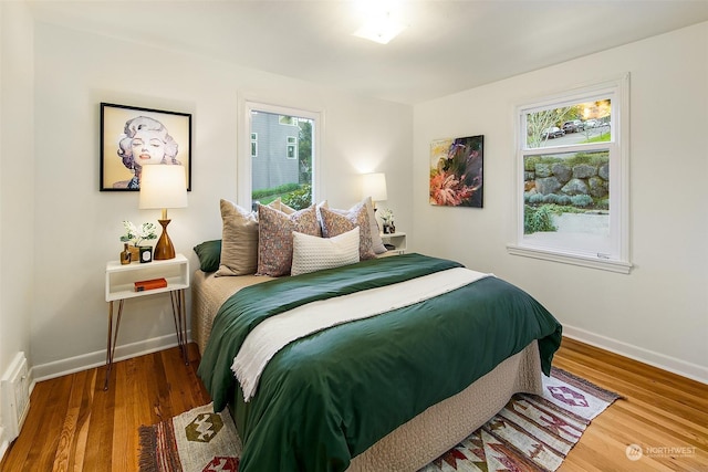 bedroom with hardwood / wood-style floors