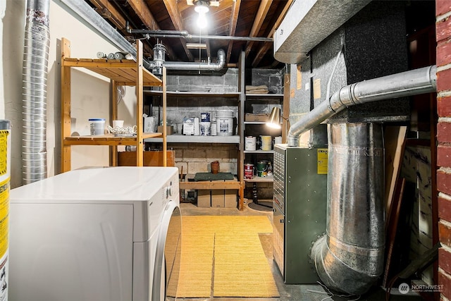 interior space with washer / clothes dryer and heating unit