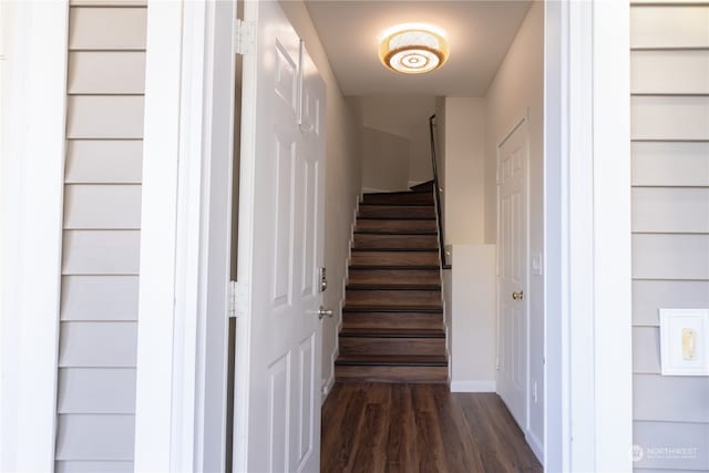 stairs featuring wood-type flooring