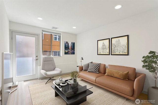 4407 42nd Ave SW Unit D, Seattle, WA 98116 - living area with recessed lighting, wood finished floors, and visible vents