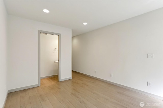 4407 42nd Ave SW Unit D, Seattle, WA 98116 - unfurnished bedroom featuring light wood-style floors, recessed lighting, and baseboards