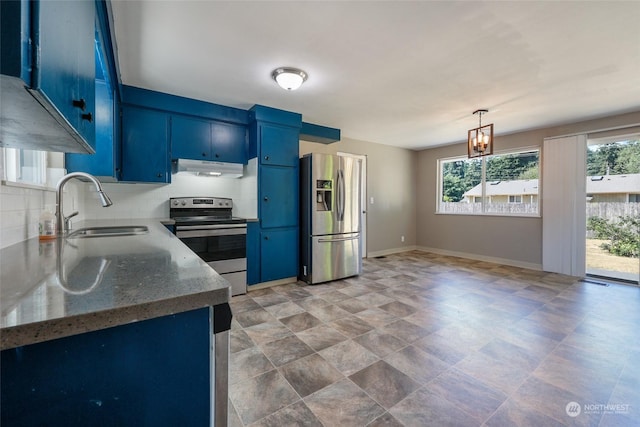 kitchen with blue cabinets, sink, appliances with stainless steel finishes, stone counters, and decorative backsplash