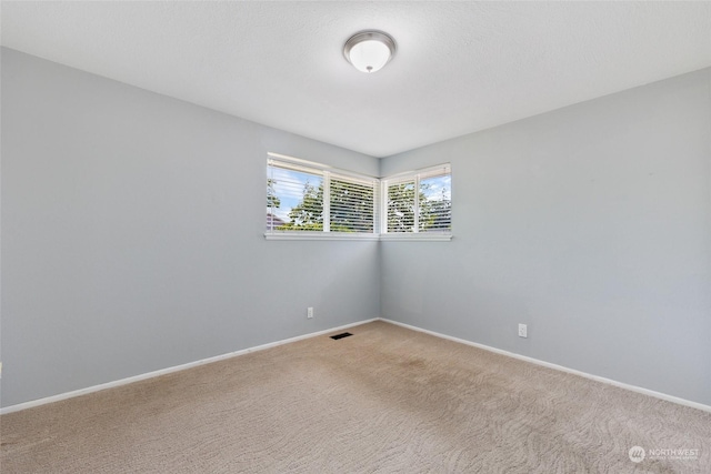 unfurnished room with carpet floors