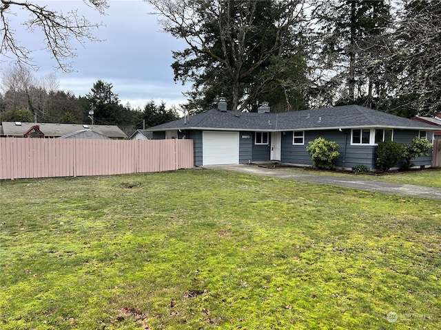 single story home featuring a garage and a front yard