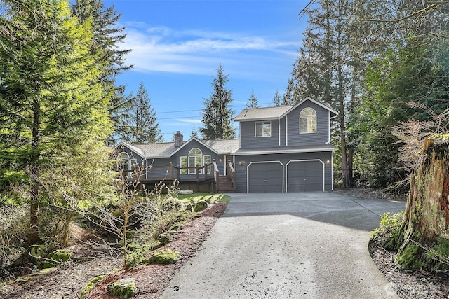 view of front facade with driveway and a garage