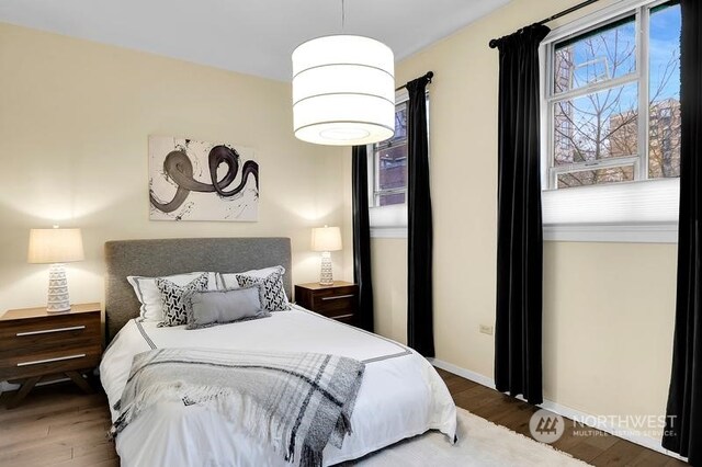 bedroom featuring dark hardwood / wood-style flooring