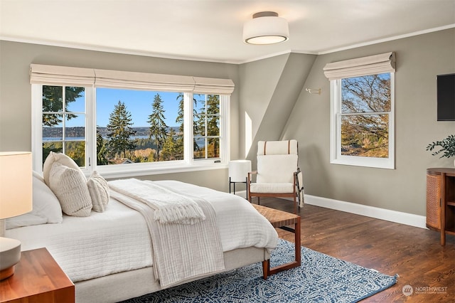 bedroom featuring dark wood-type flooring and ornamental molding