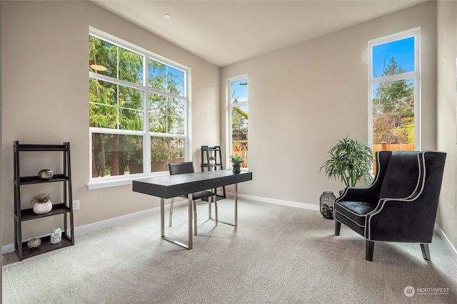 carpeted office featuring baseboards