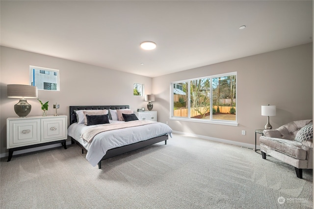 bedroom featuring baseboards and carpet floors